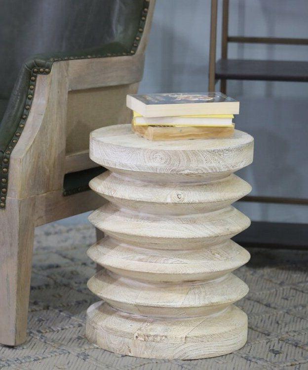 Light wood side table next to a chair