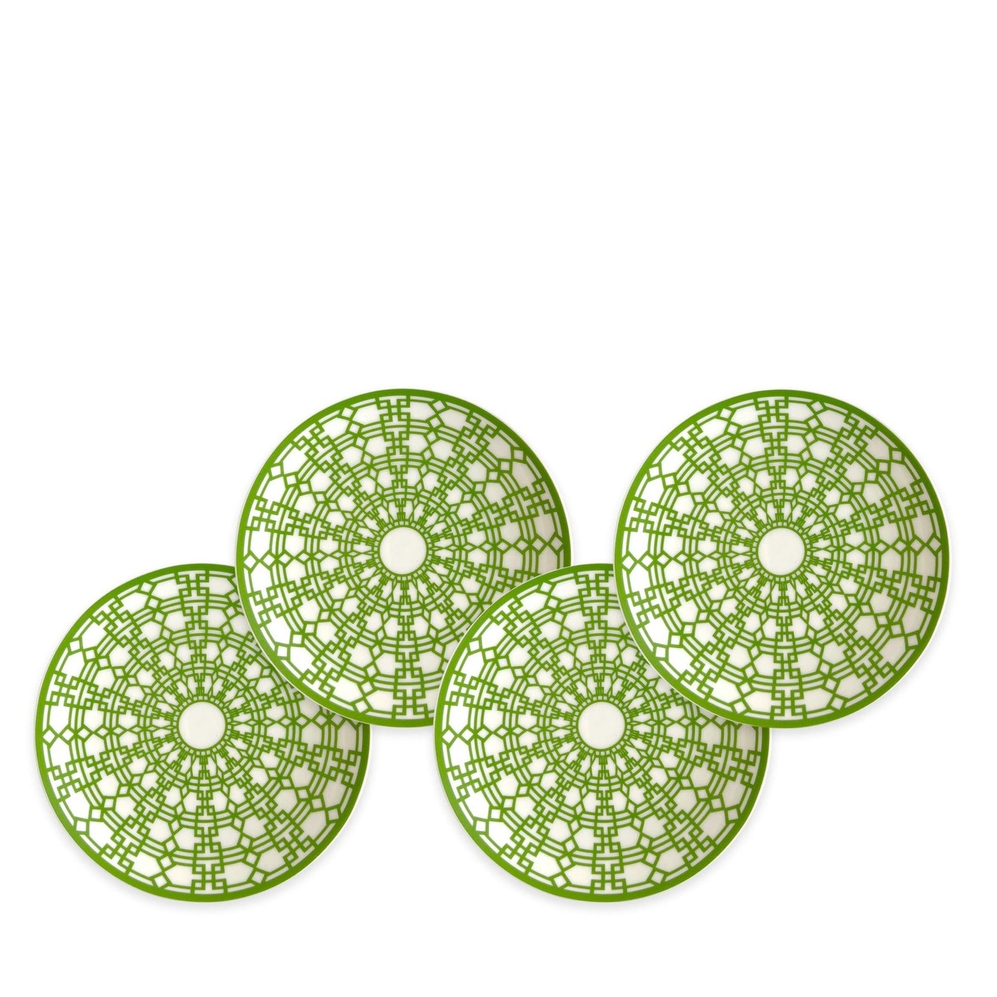 three green plates sitting on top of a white table