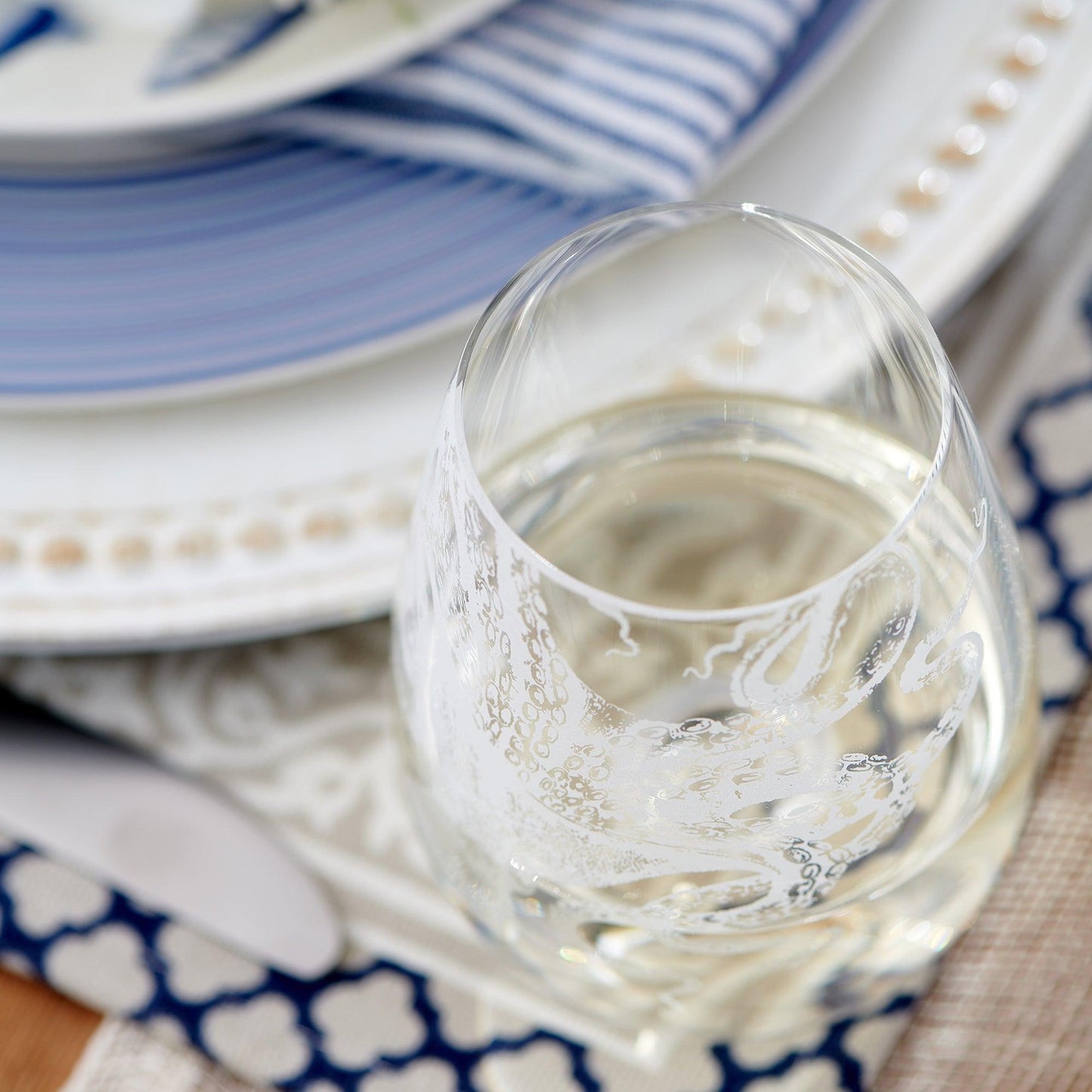 a close up of a wine glass on a table