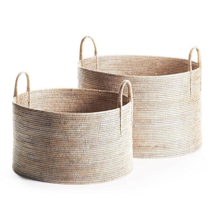 two round baskets with handles on each of them