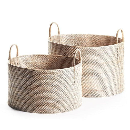 two round baskets with handles on each of them