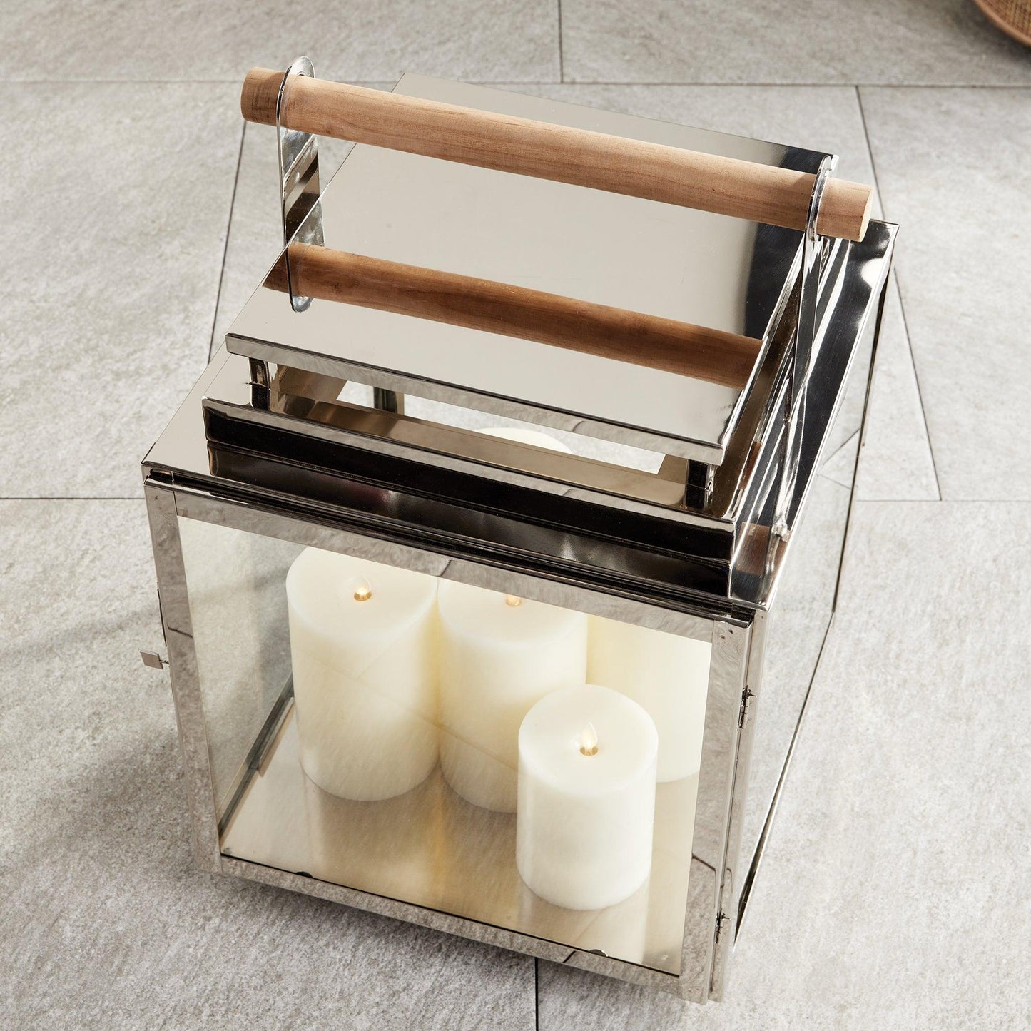 Silver lantern with wood handle with candles