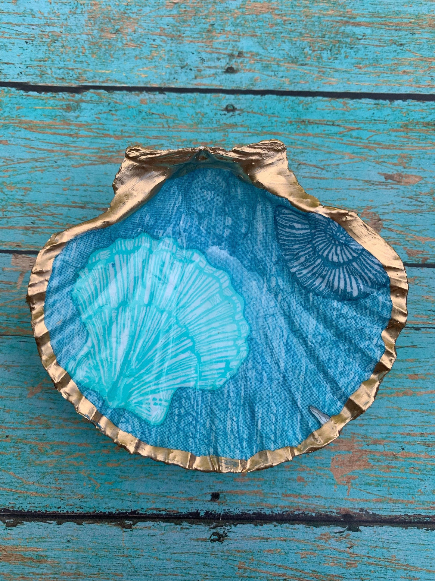 Gold shell with blue painted design