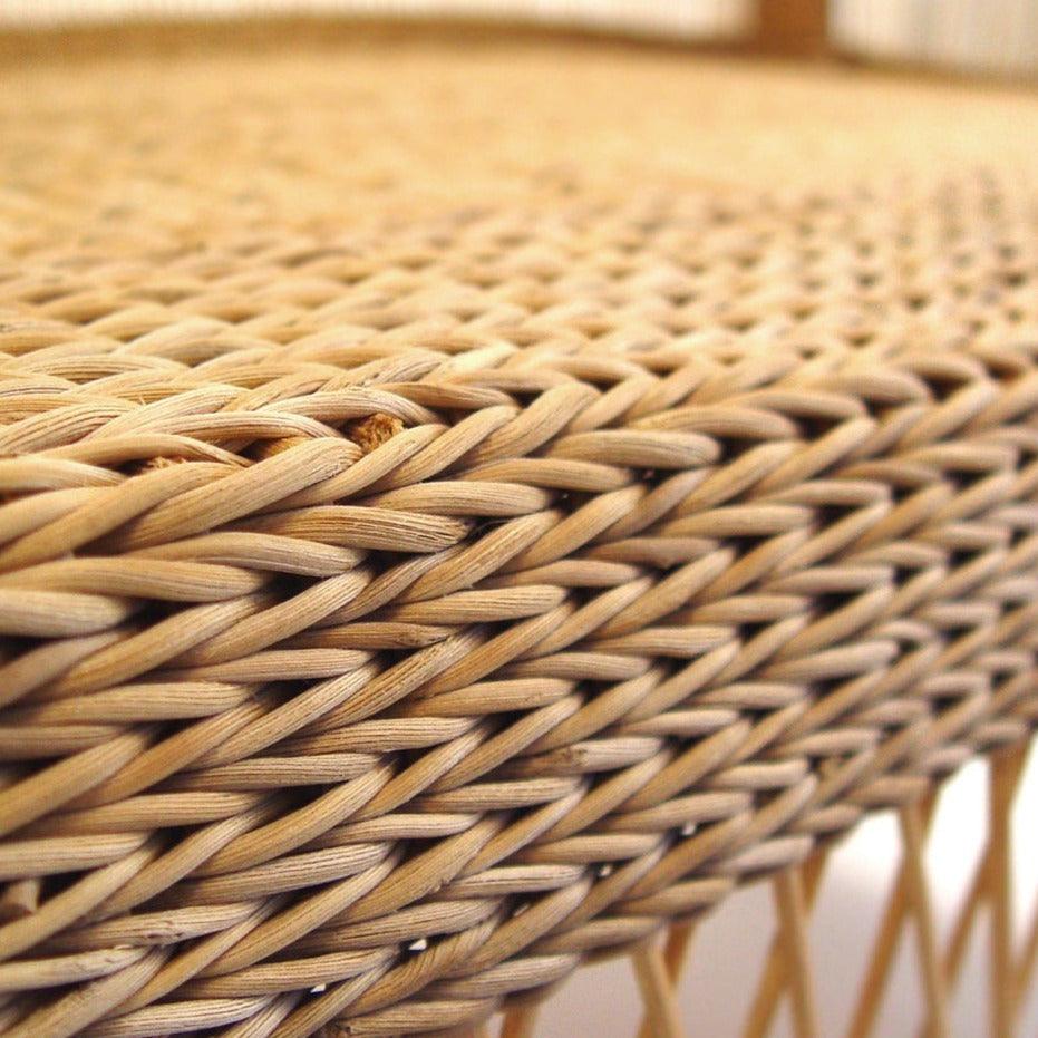 a close up view of a wicker chair
