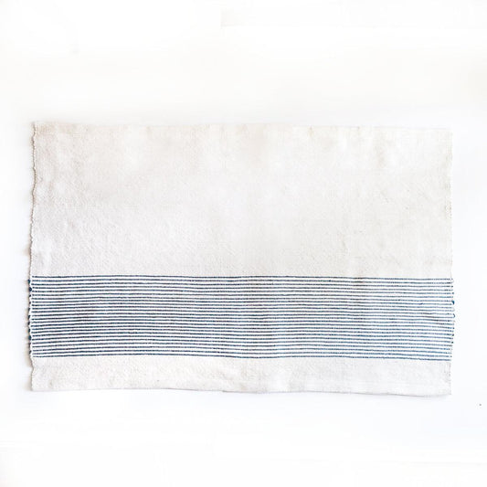 a white towel with a blue stripe on it
