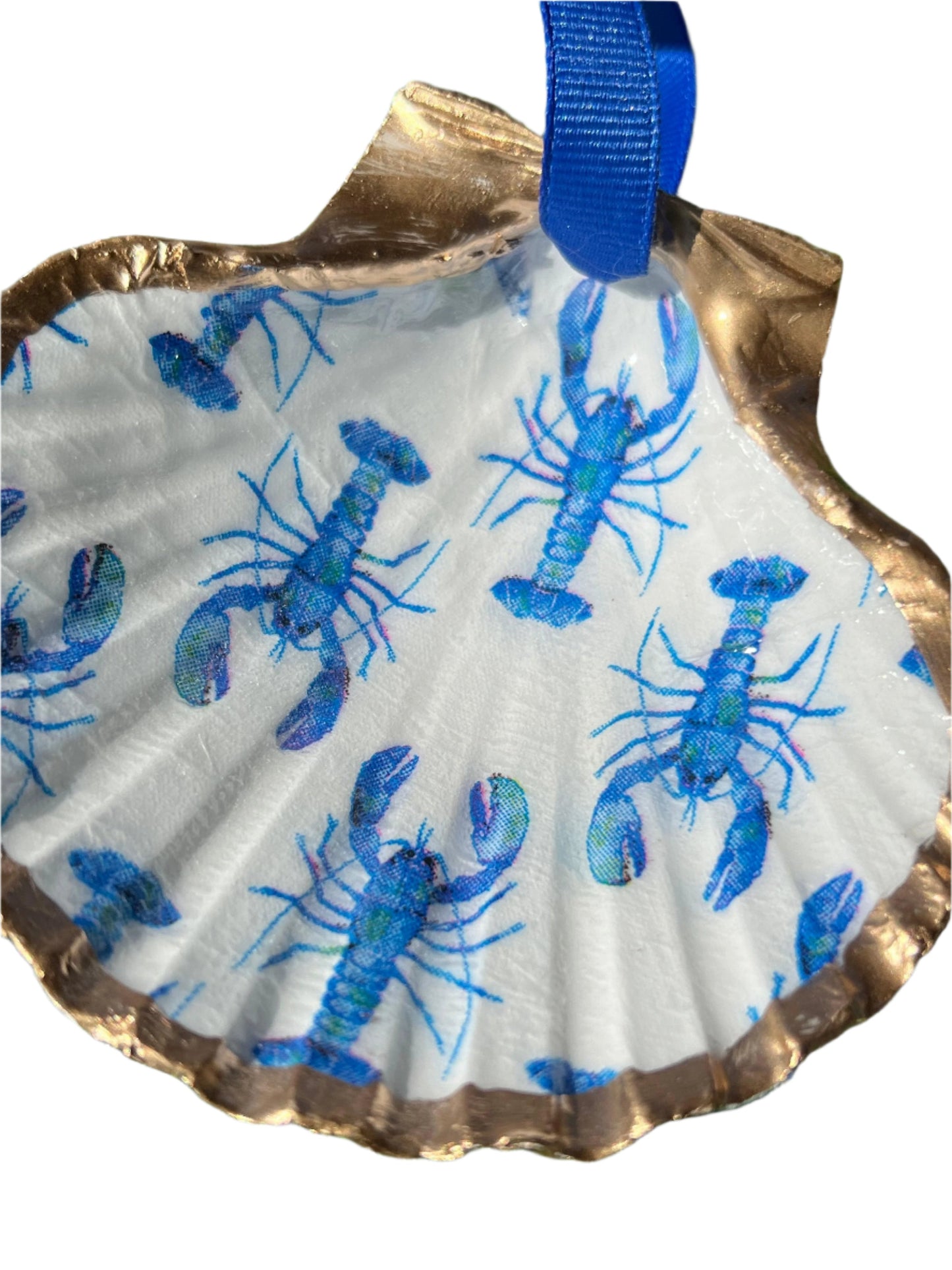 Gold shell painted white with blue lobsters