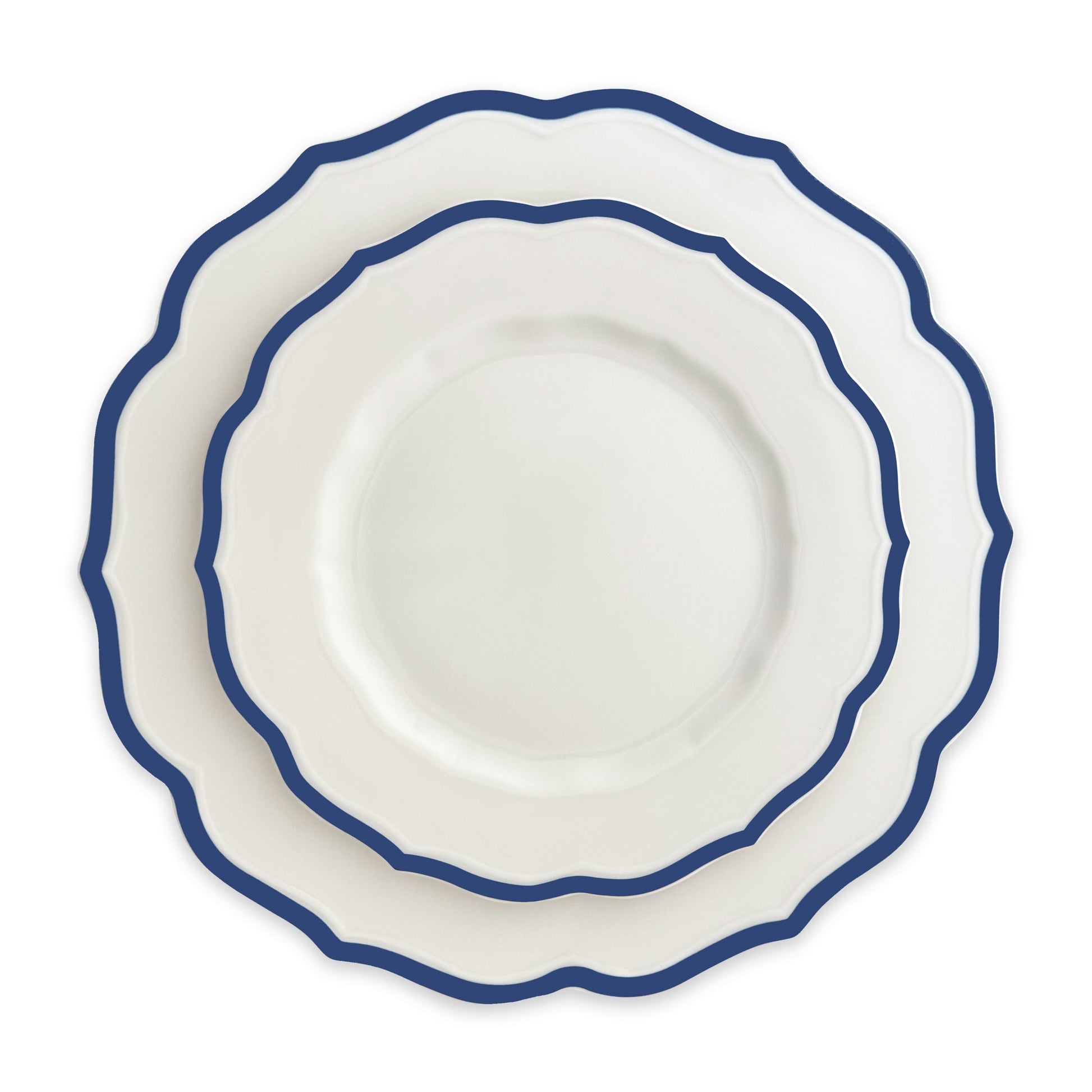 two stacked white scalloped plates with blue rim