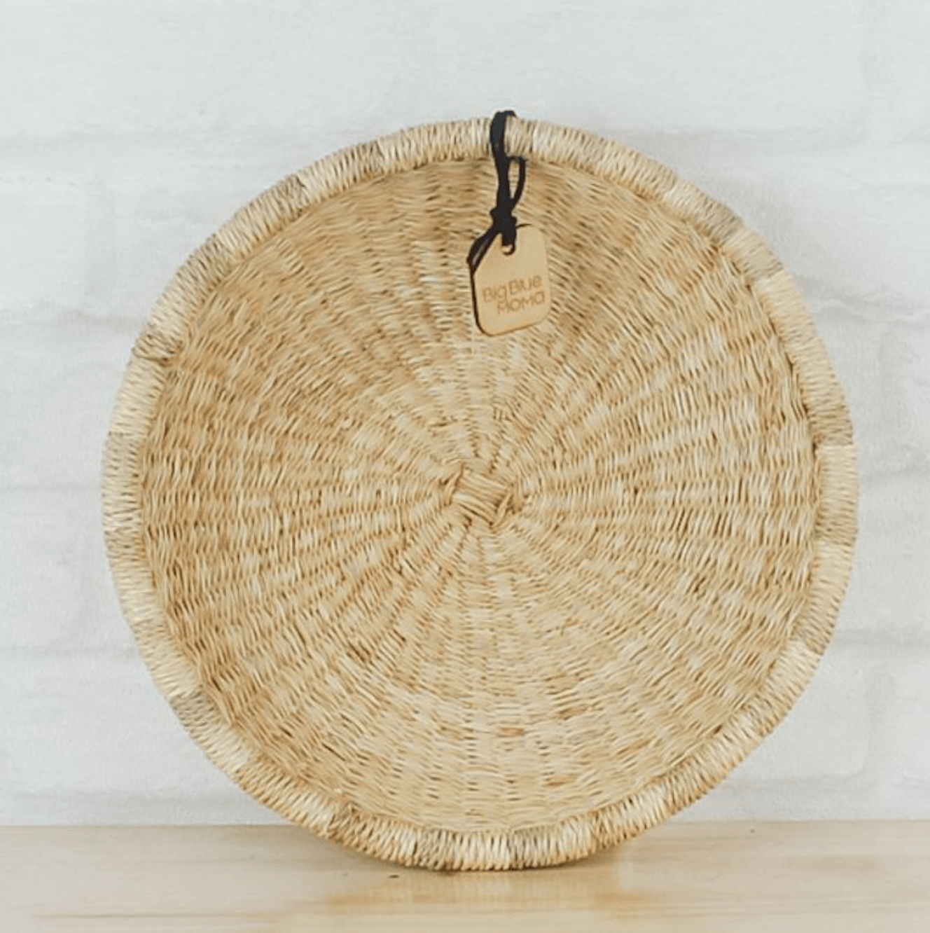 a wicker basket sitting on top of a wooden table