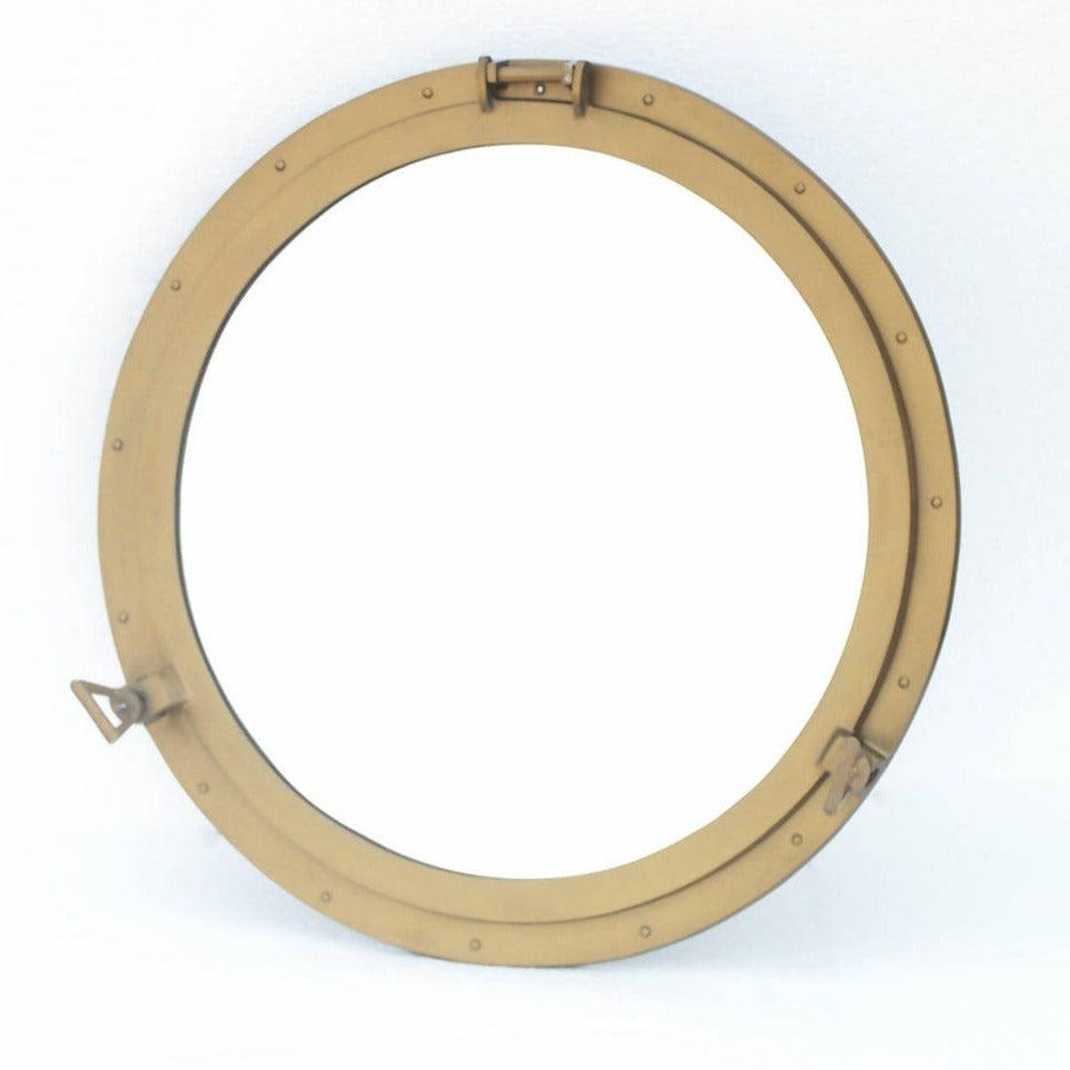 a porthole mirror on a white background