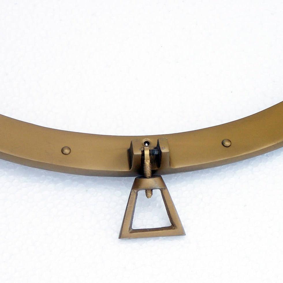 a close up of a metal object on a white surface