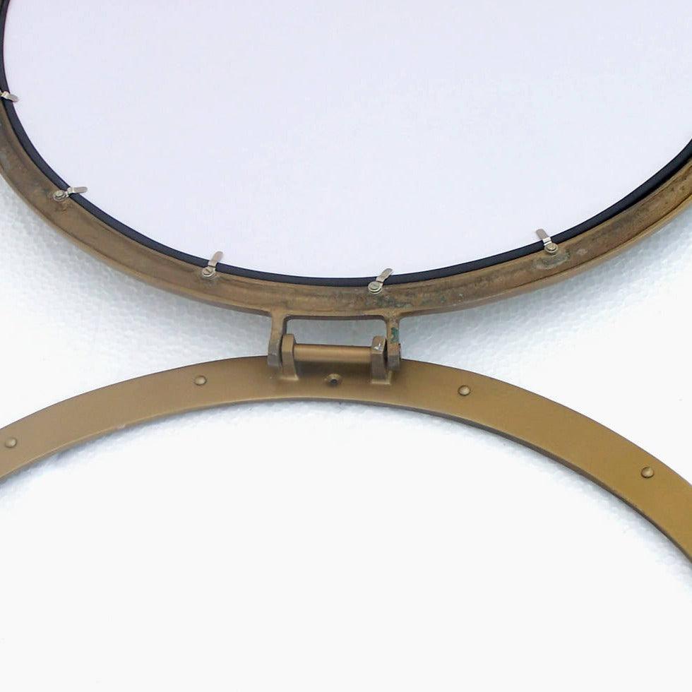 a close up of a mirror on a wall