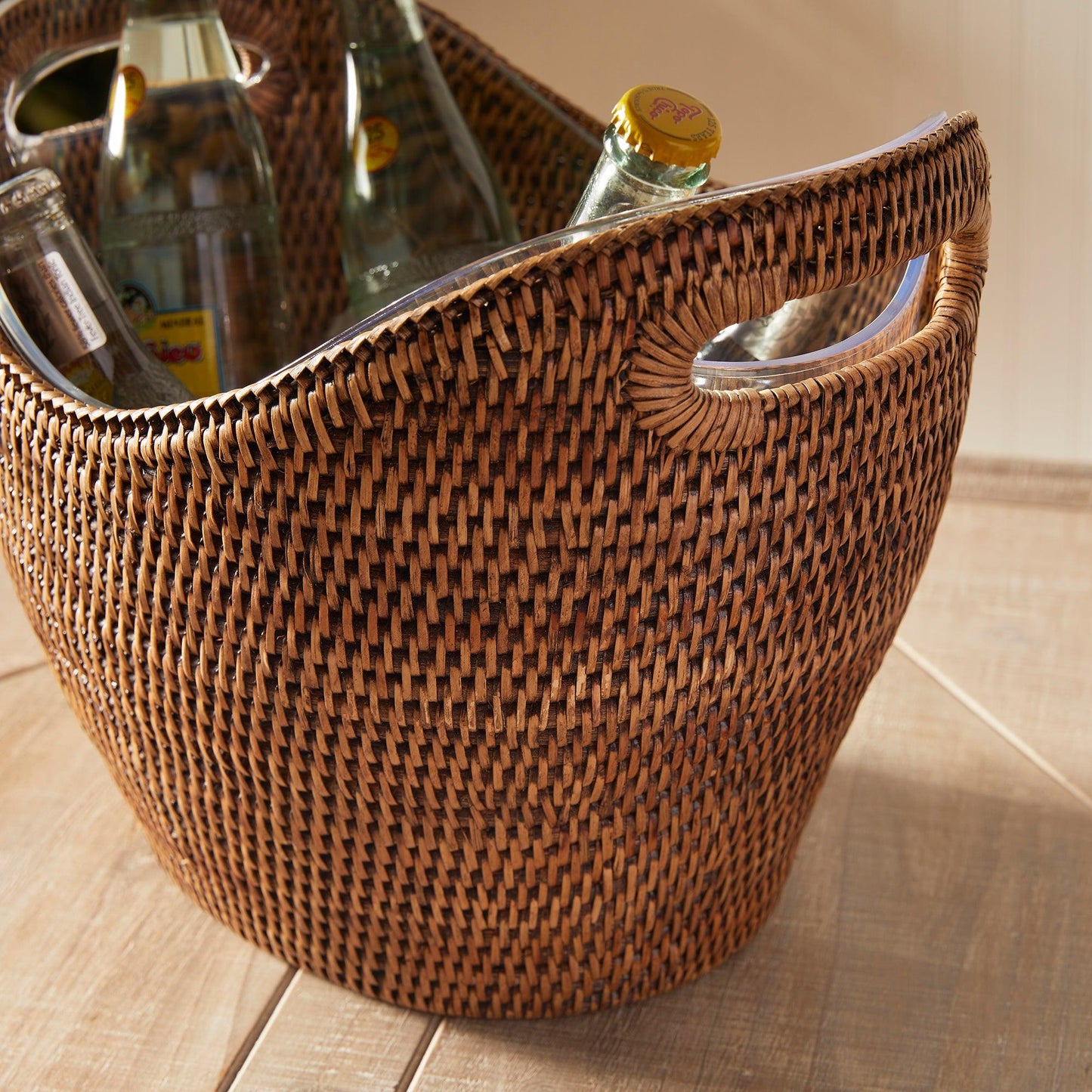 a woven basket with two bottles in it
