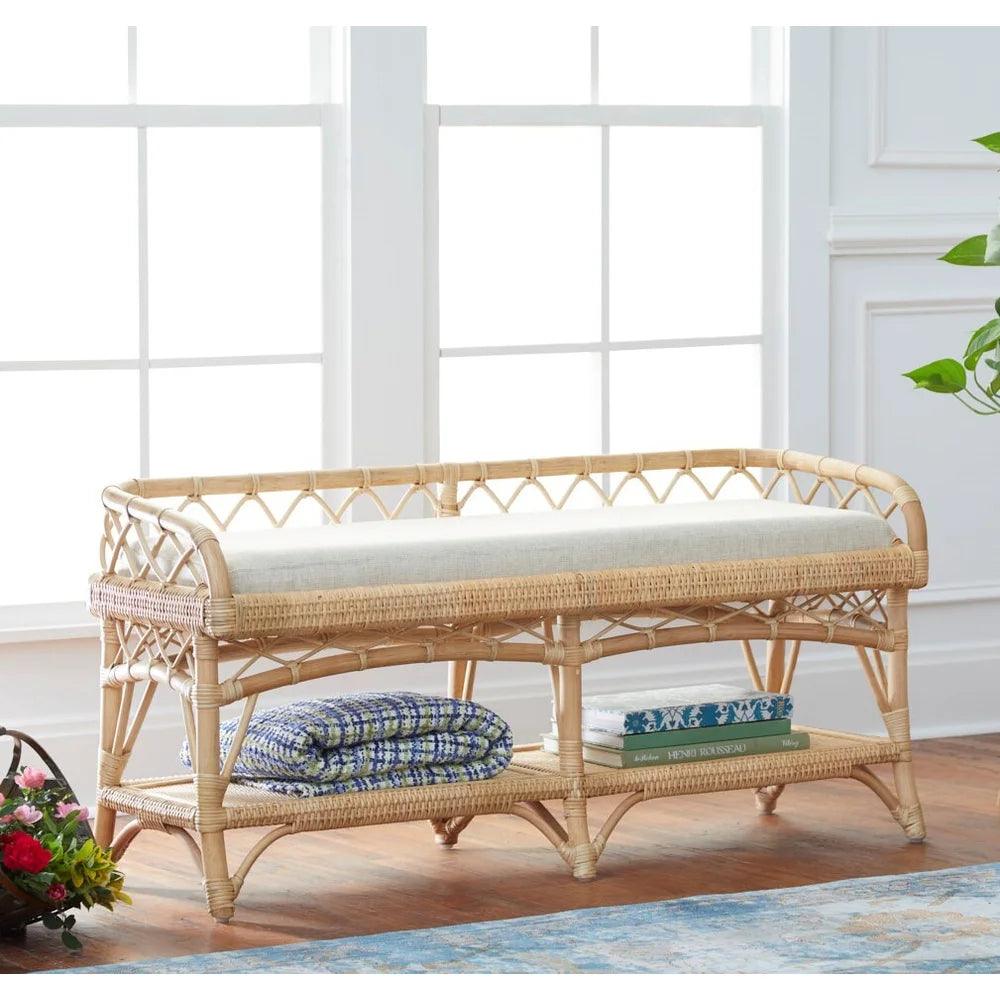a wicker bench with a cushion on top of it