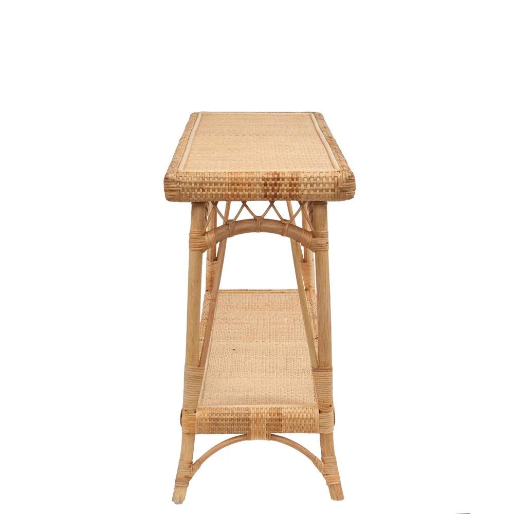 a wicker table with a shelf on top of it