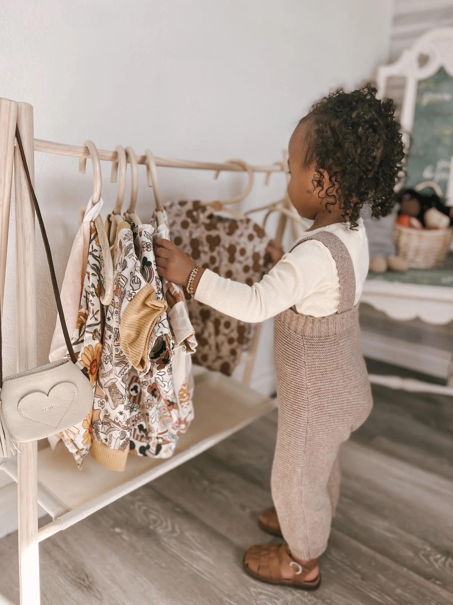 childrens room with hanging clothes