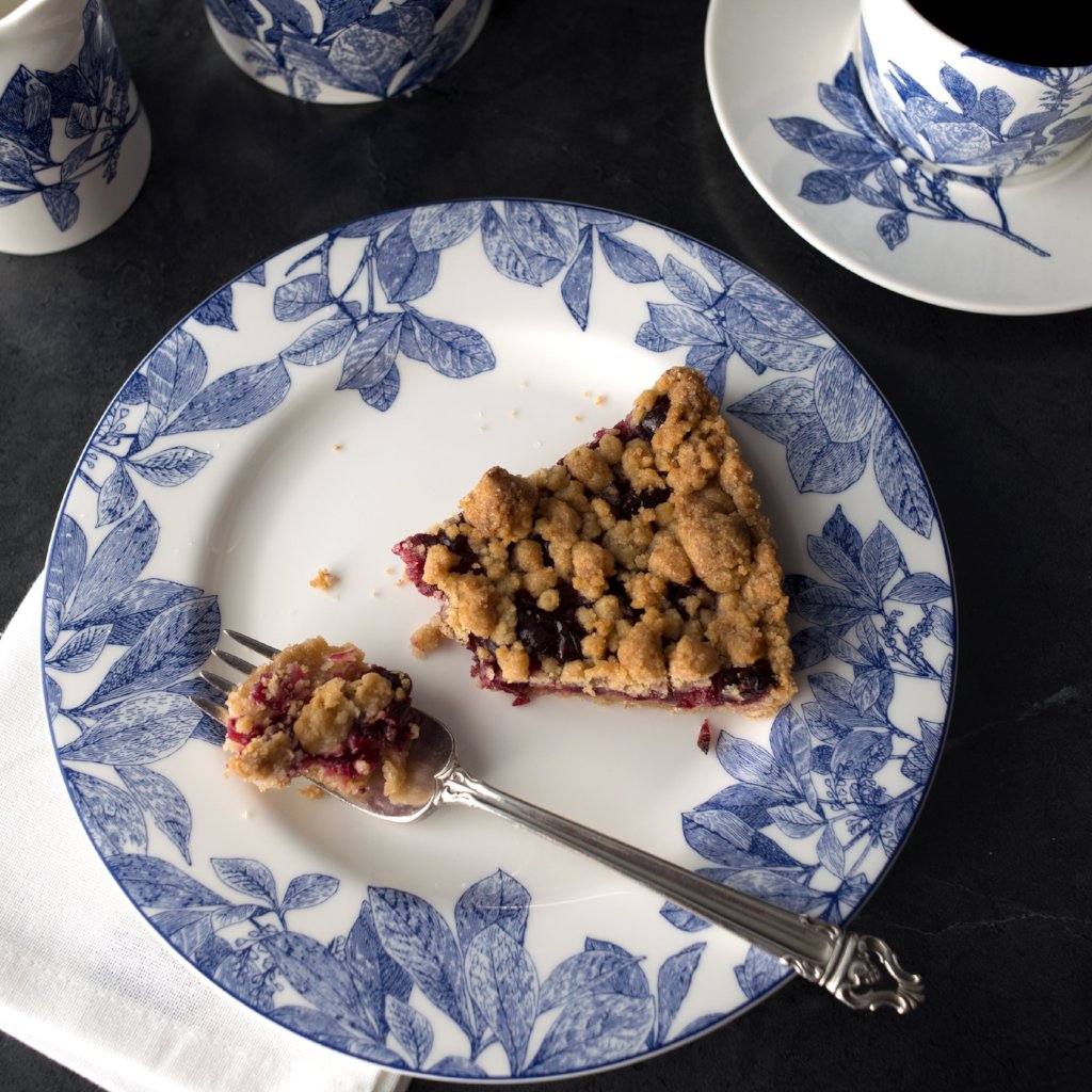 blue and white dish with a slice of pie