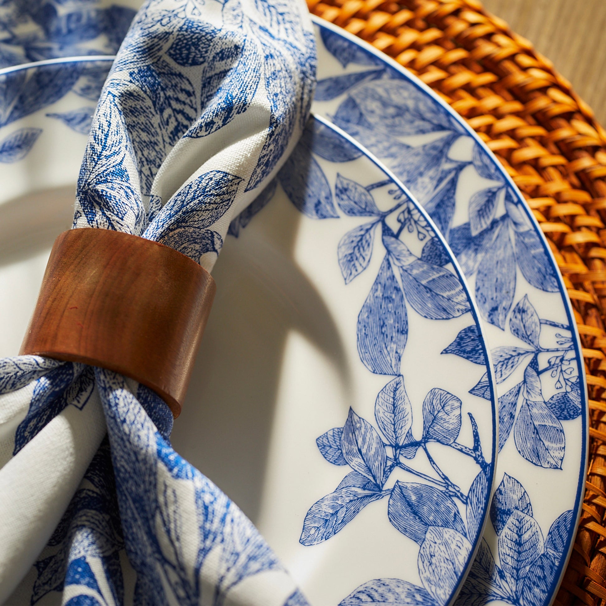 close up of blue and white plates and napkin