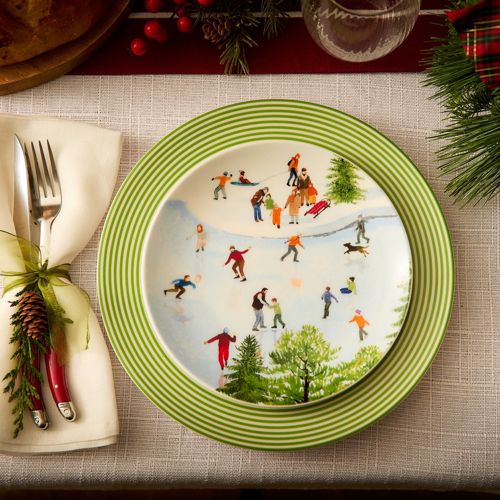 christmas place setting with plates on placemat