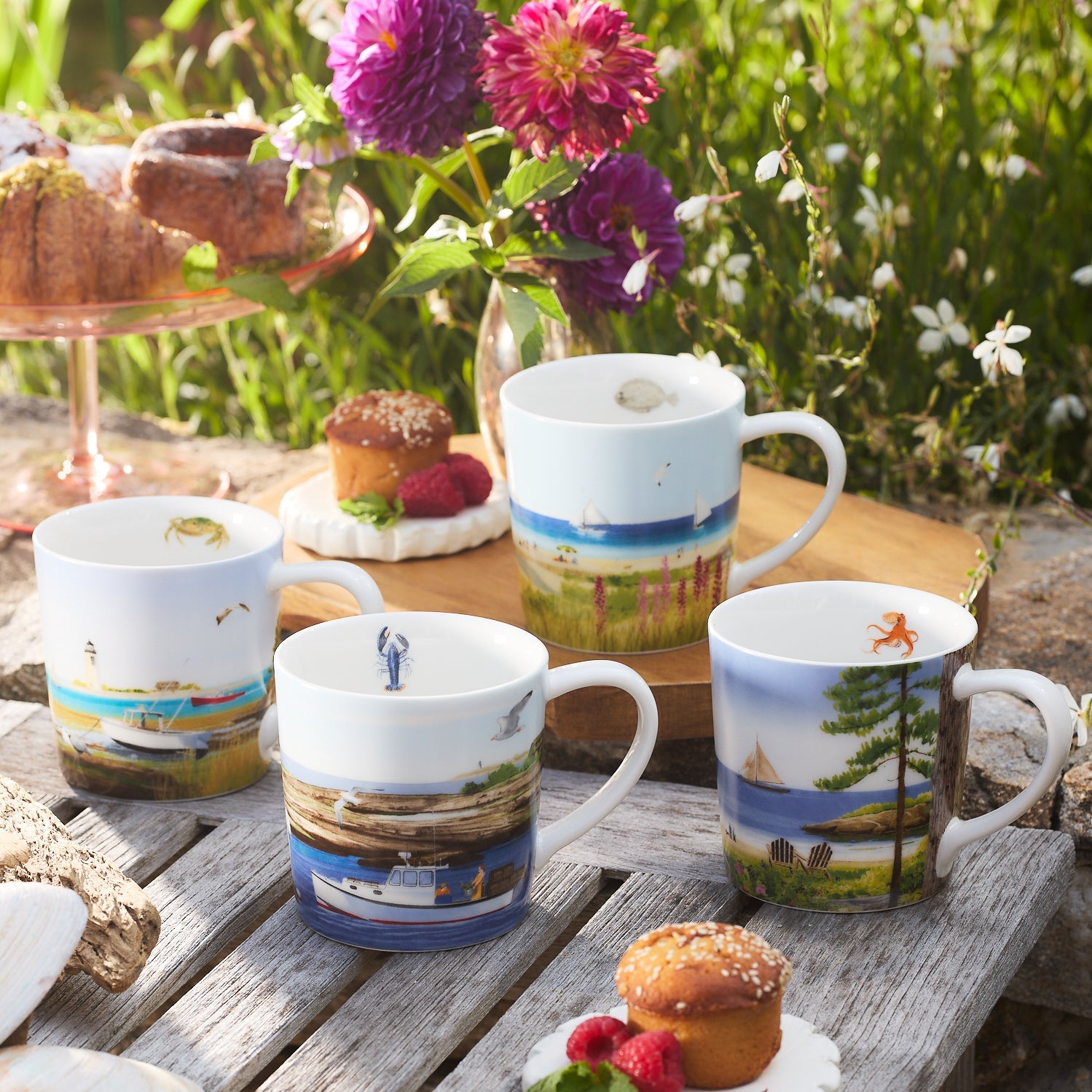 4 coffee mugs on a woods table