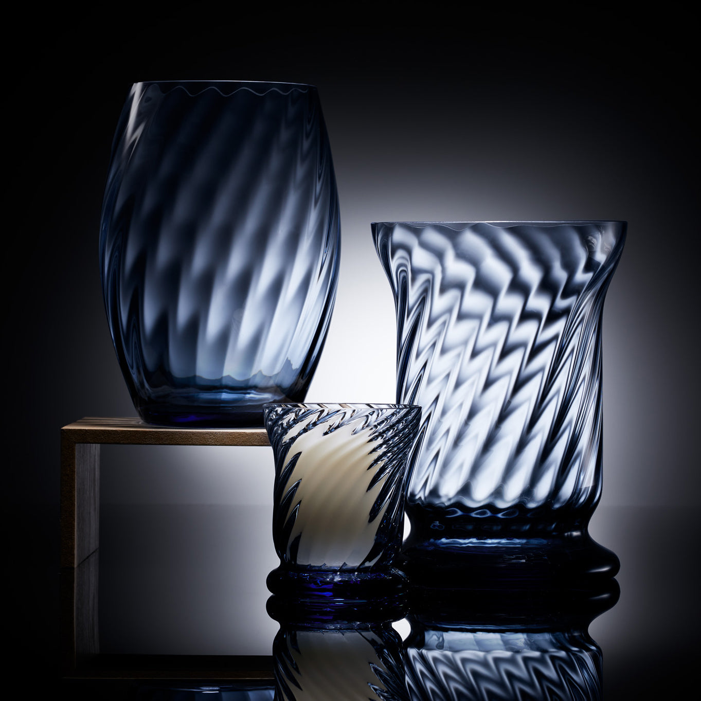 three blue crystal candle holders
