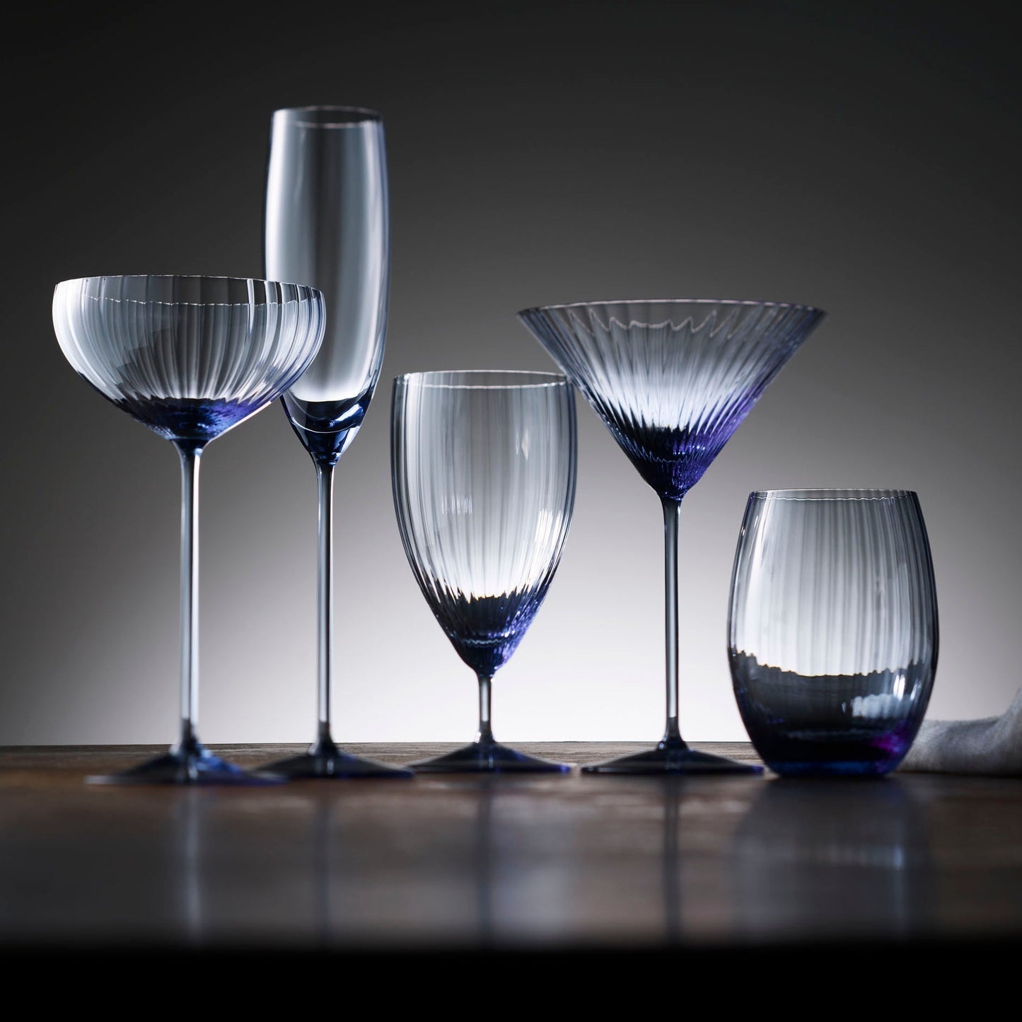 five blue barware glasses