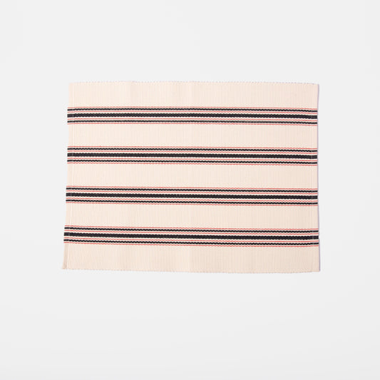 white placemat with red and blue stripes