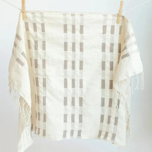 a white towel hanging on a clothes line