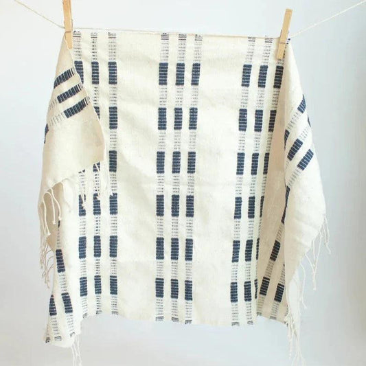 a black and white towel hanging on a clothes line