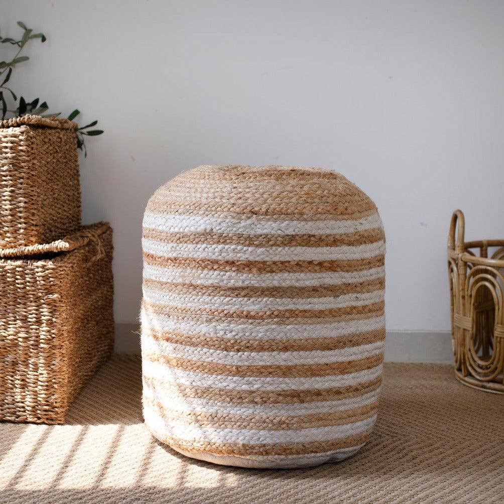 a large round basket sitting on top of a floor next to two smaller baskets