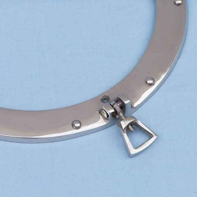a close up of a chrome porthole mirror