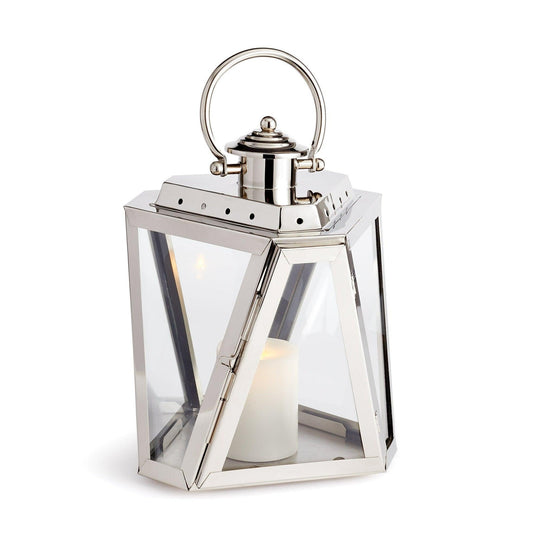 Silver lantern with candle inside