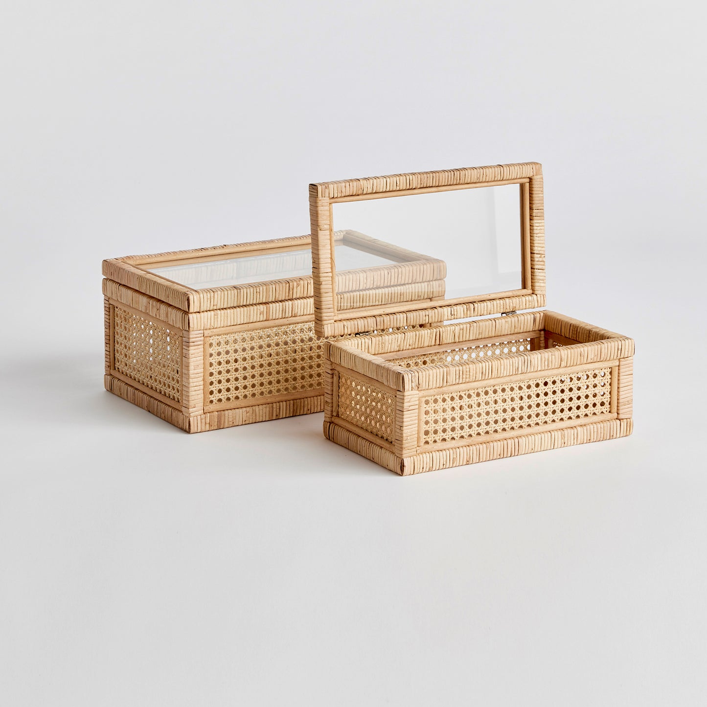 two rattan boxes with lids