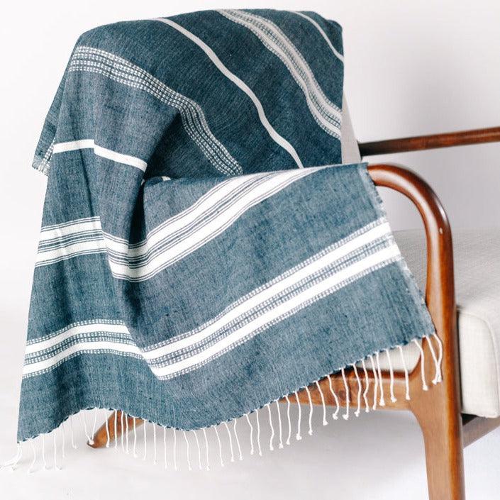 a chair with a blanket on top of it