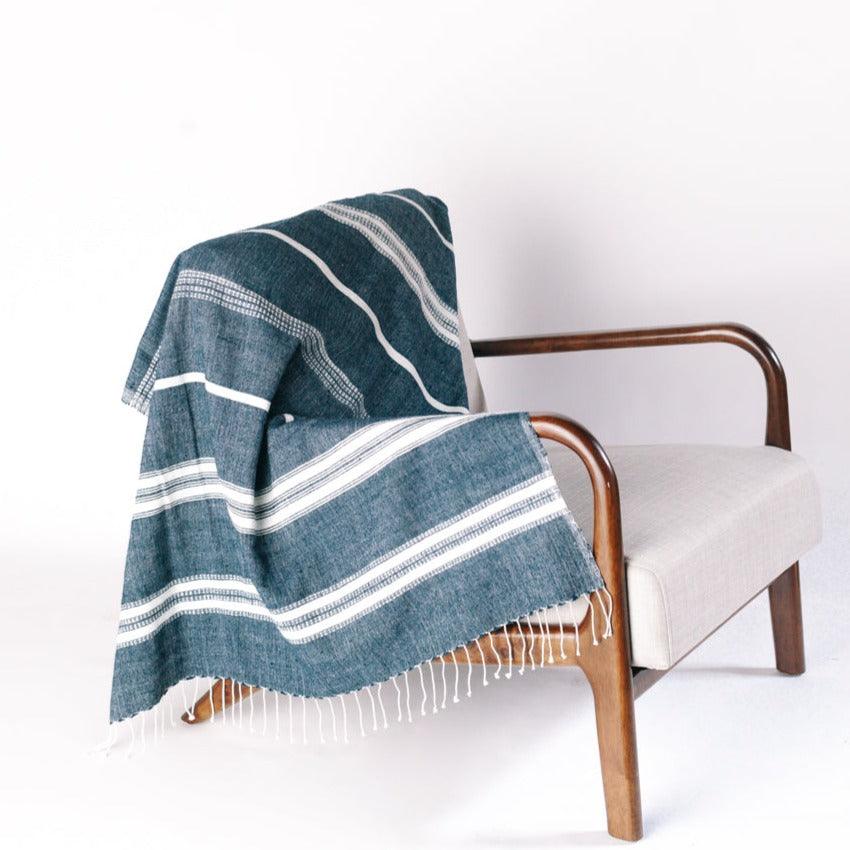 a chair with a blanket on top of it