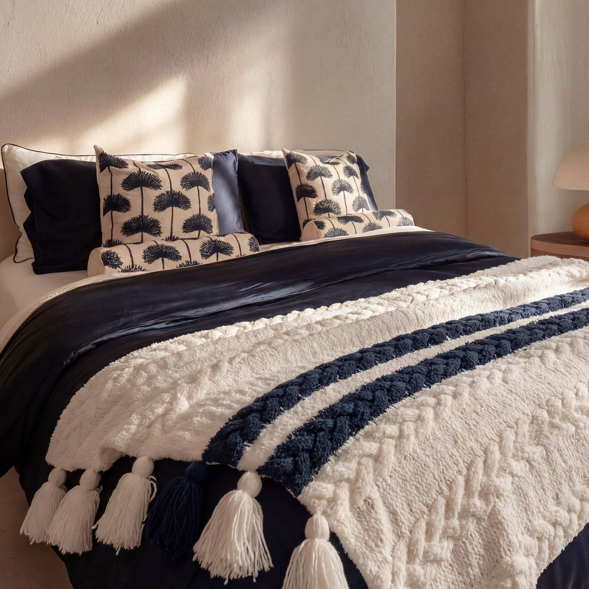 Midnight and White Snug throw blanket styled on sofa