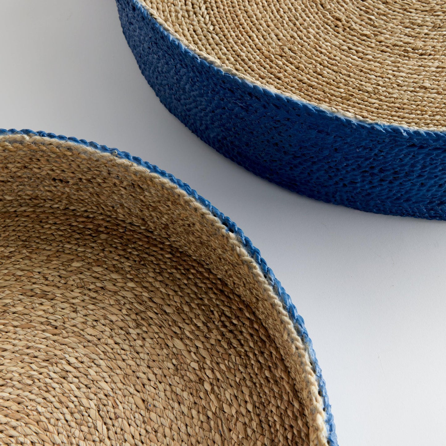 a close up of two baskets on a table