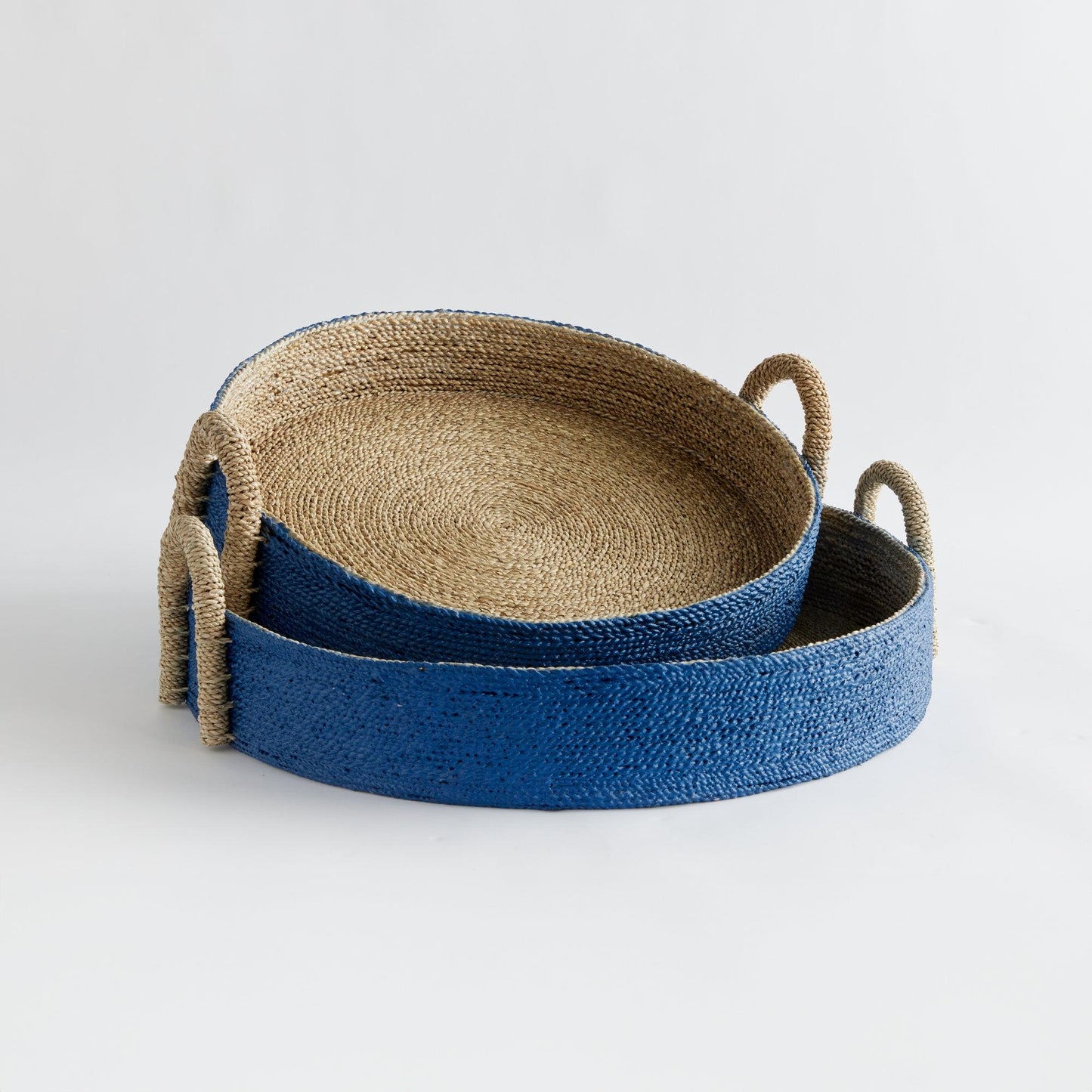 two blue baskets with handles on a white background