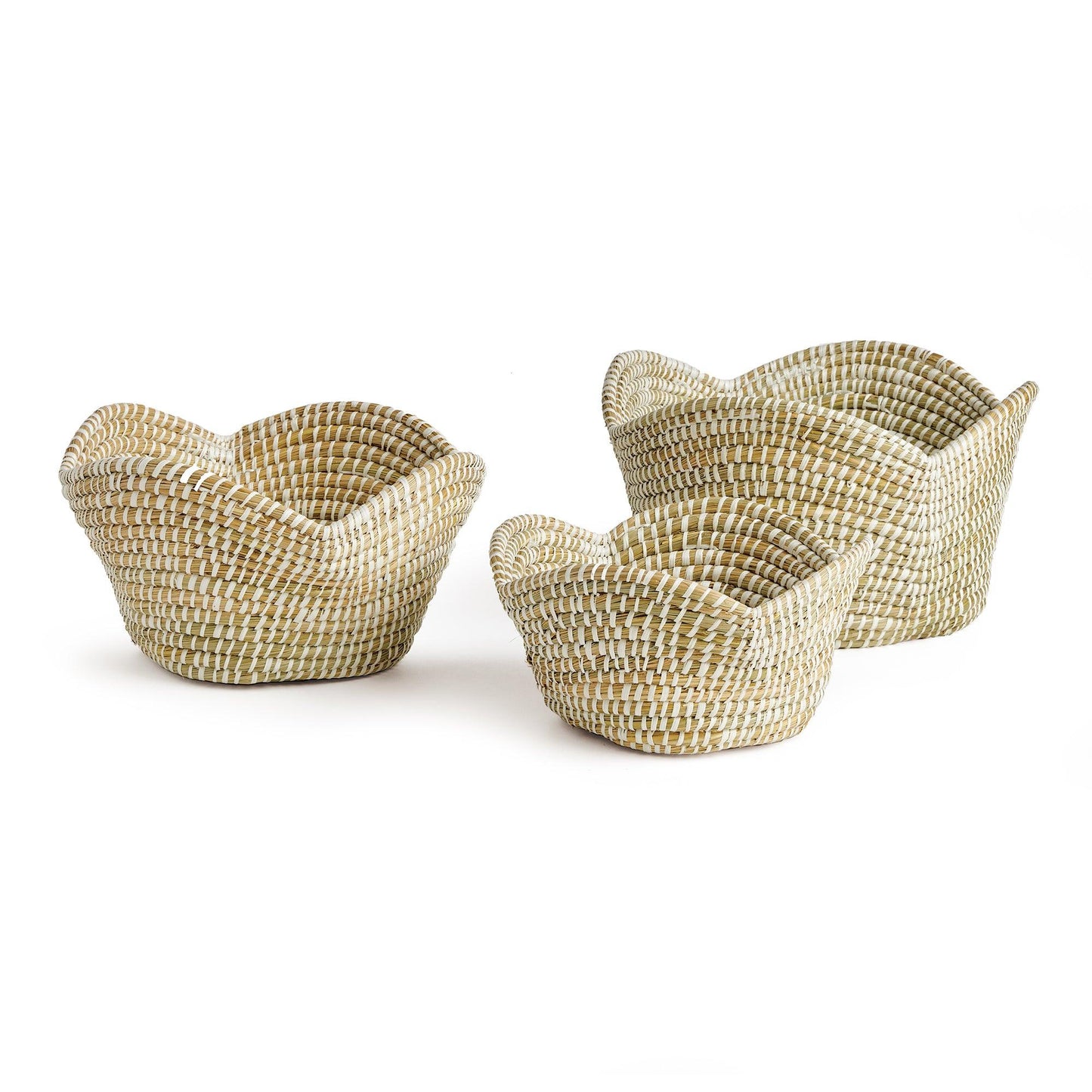 a set of three woven baskets sitting on top of each other