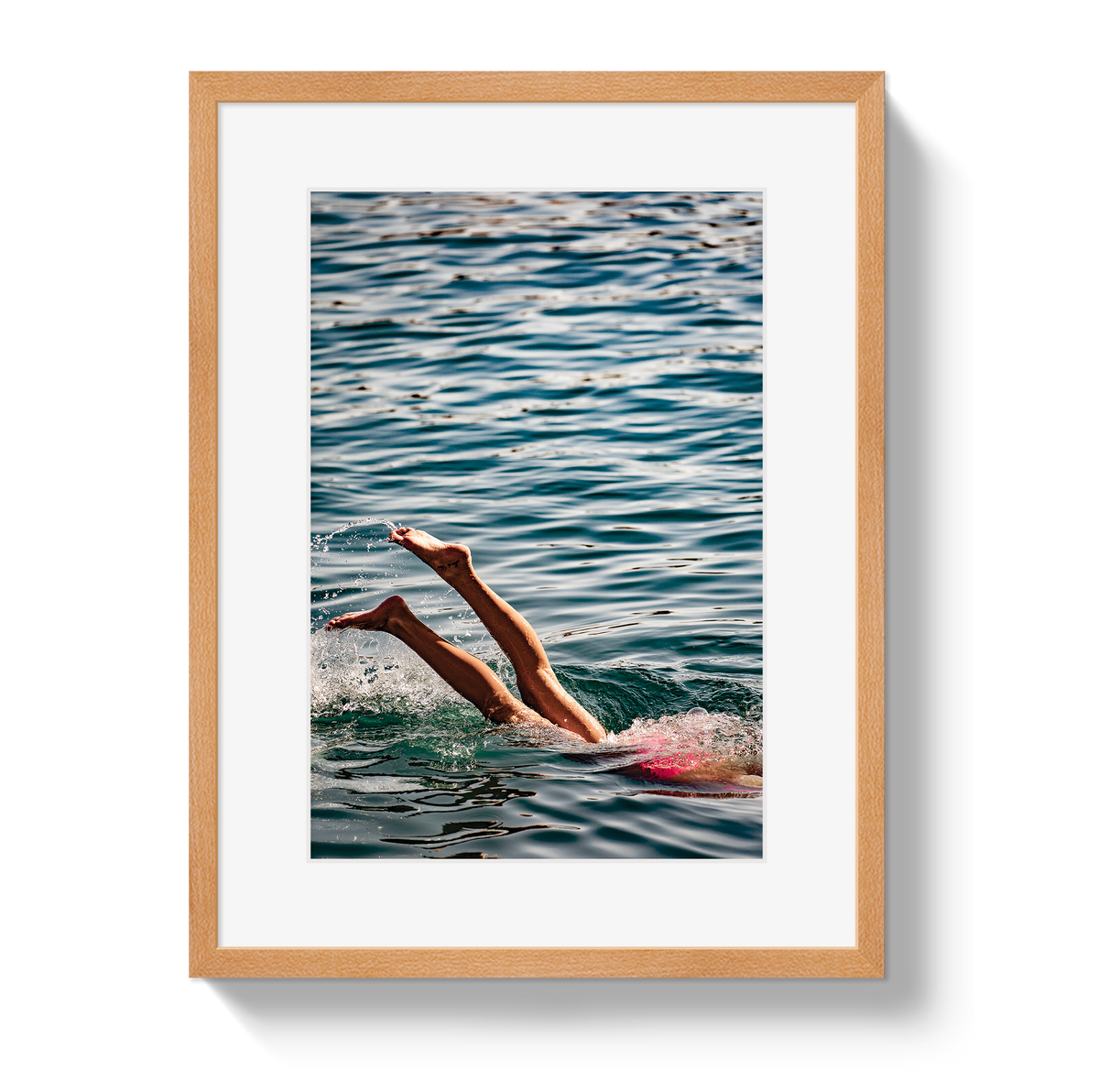 Joy Of Life swimmer photograph in a natural wood frame with a white border