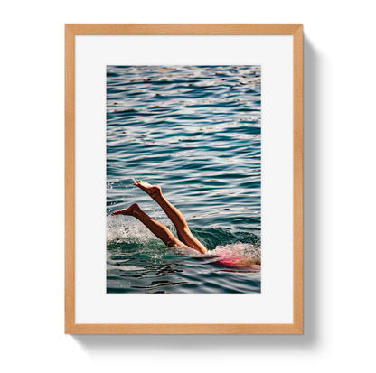 Joy Of Life swimmer photograph in a natural wood frame with a white border