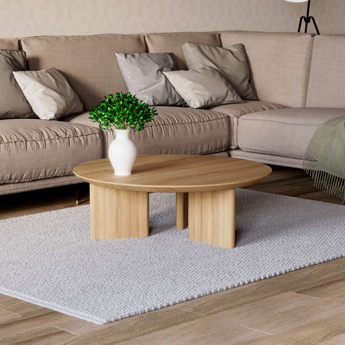 Noah solid oak coffee table beside a beige sectional on a textured light rug