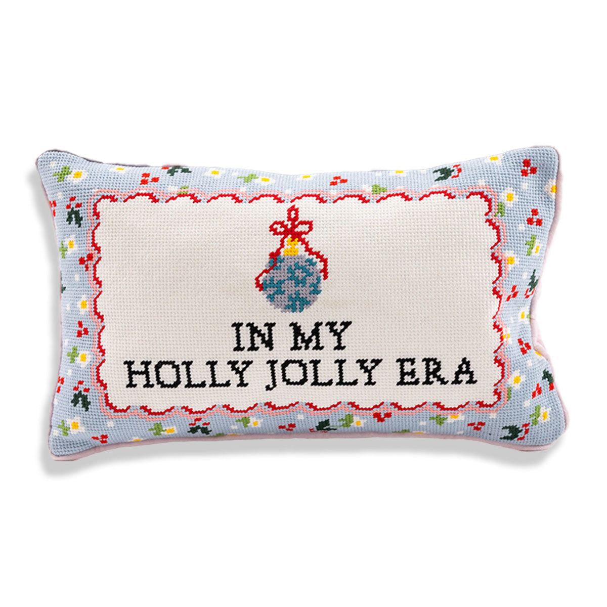 In My Holly Jolly Era needlepoint pillow with black lettering, a blue ornament, red scalloped detailing, and a colorful border