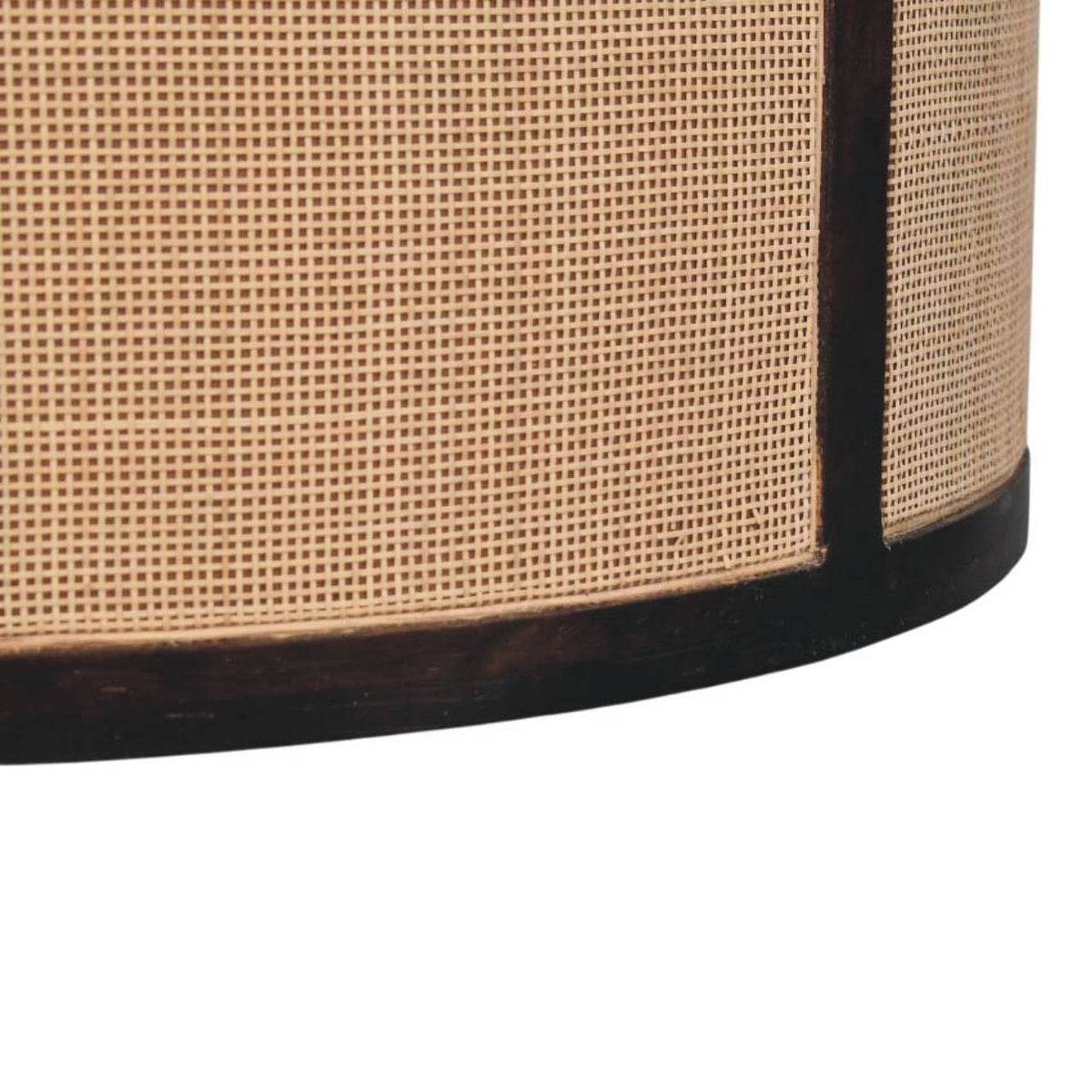 	Close-up of the natural rattan weave bordered by the Monaco table’s dark wood frame