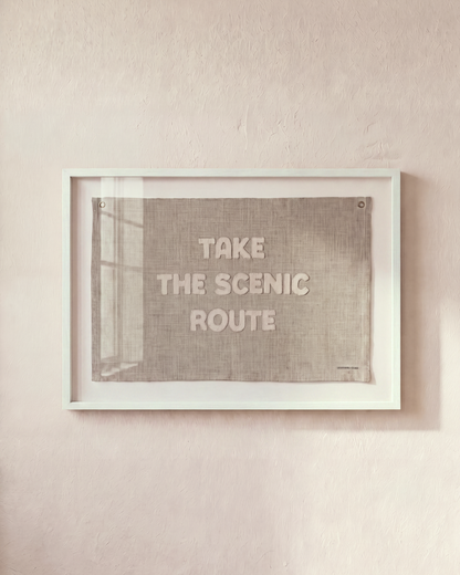 Take the Scenic Route sand-colored flag in a white shadowbox frame