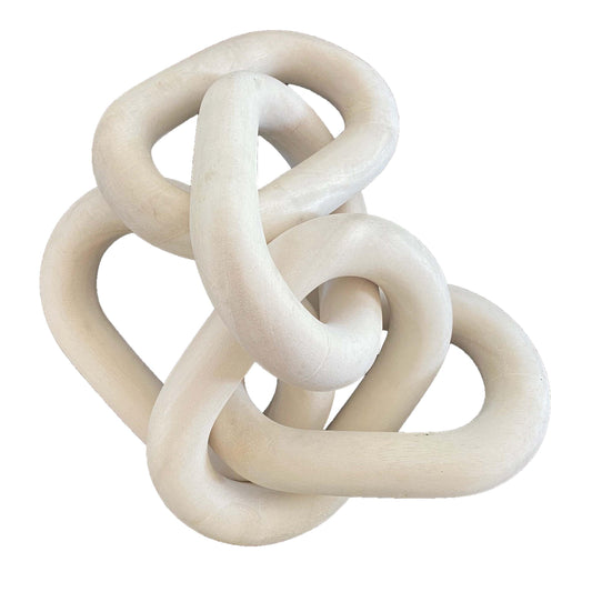a white sculpture of interlocked circles on a white background
