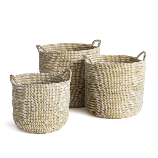 three woven baskets sitting next to each other