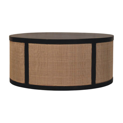 	Monaco round coffee table with a dark brown wood top and frame surrounding natural woven rattan panels
