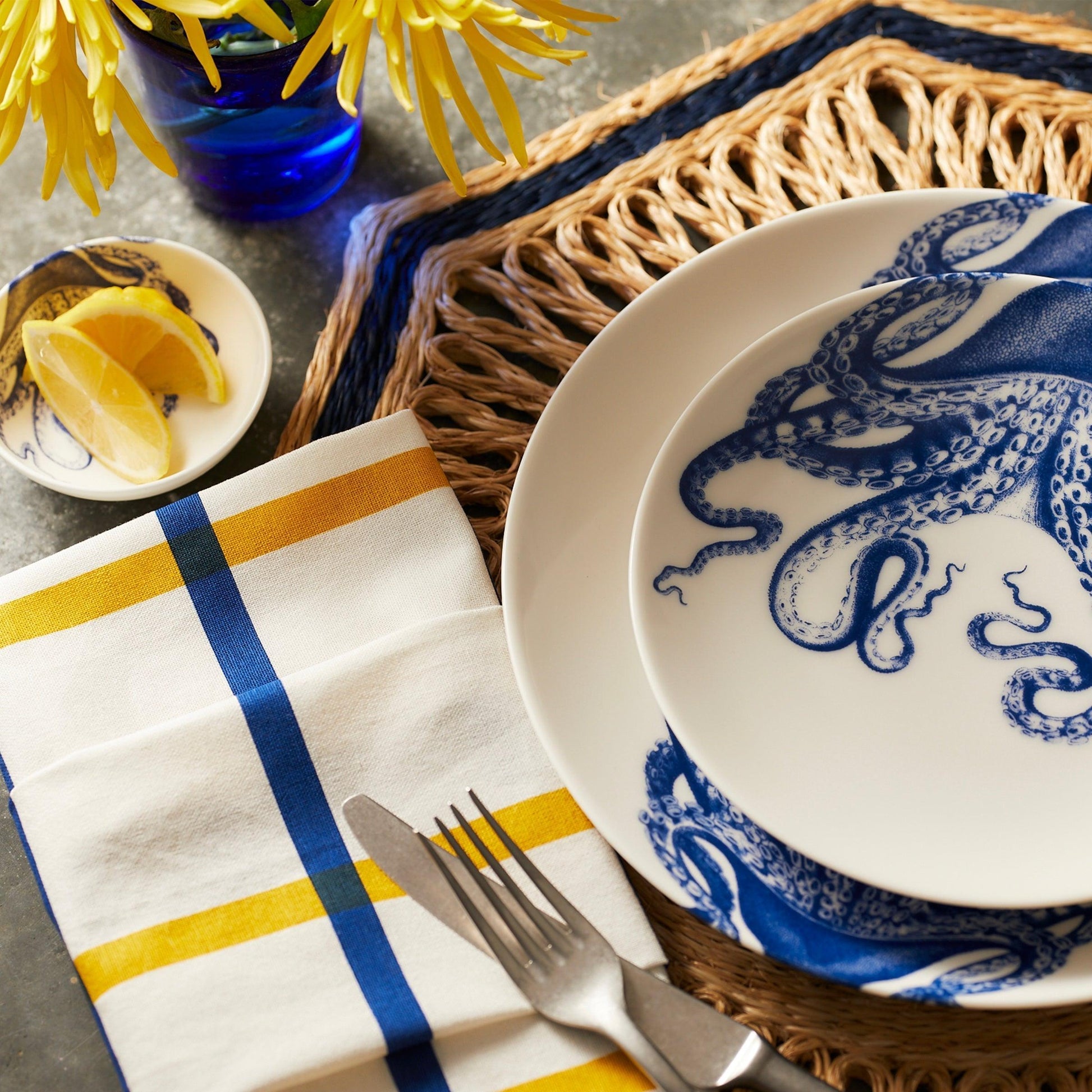 a blue and white plate with an octopus on it