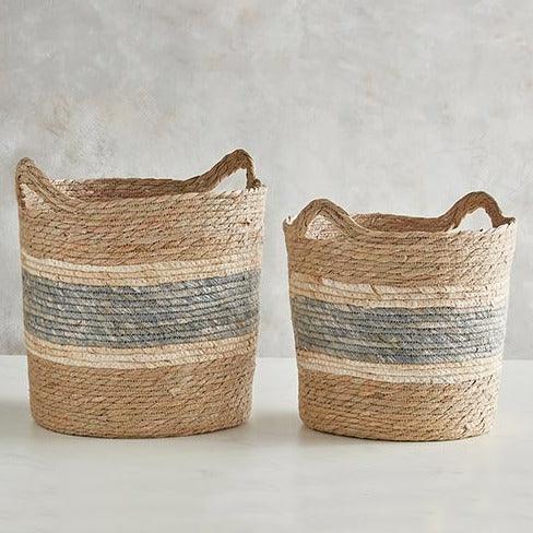 a pair of baskets sitting on top of a table