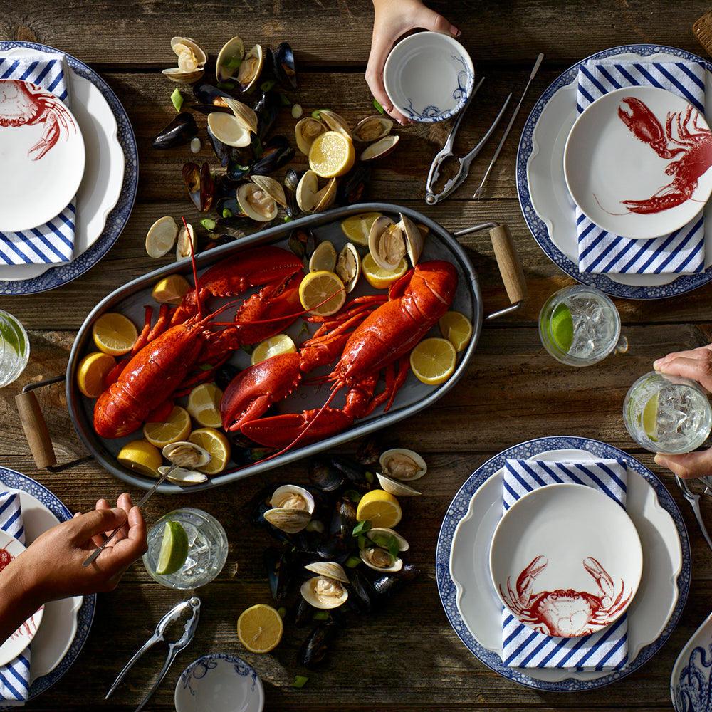 a table topped with lobsters and clams